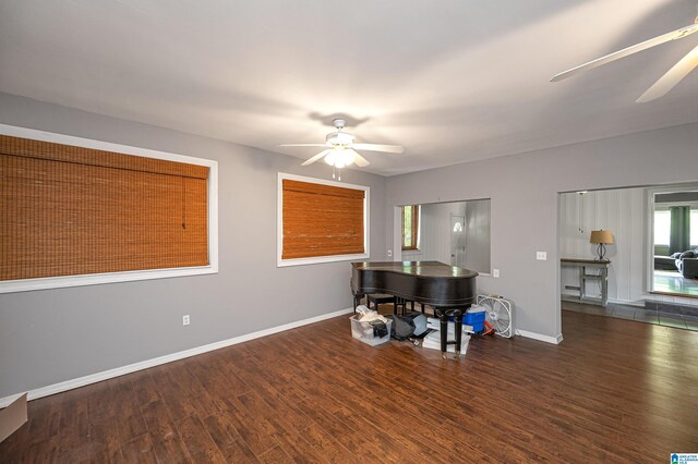 interior space with dark hardwood / wood-style floors and ceiling fan