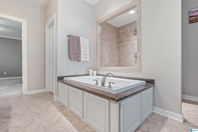 bathroom featuring tile patterned flooring and a tile shower