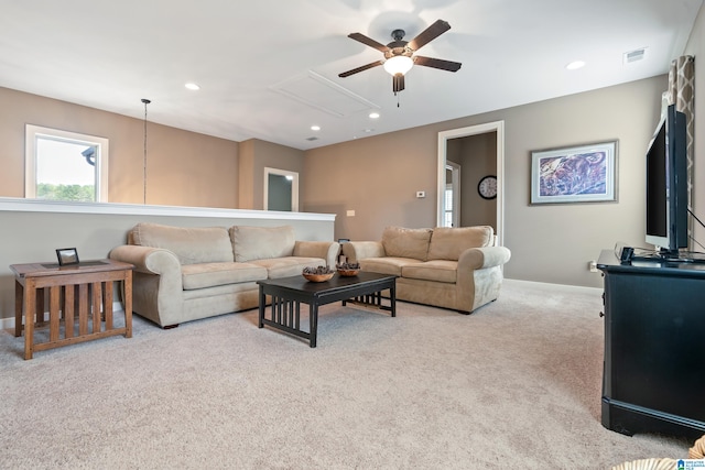 living room with ceiling fan and light colored carpet