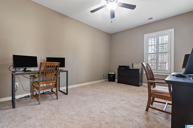 carpeted office featuring ceiling fan