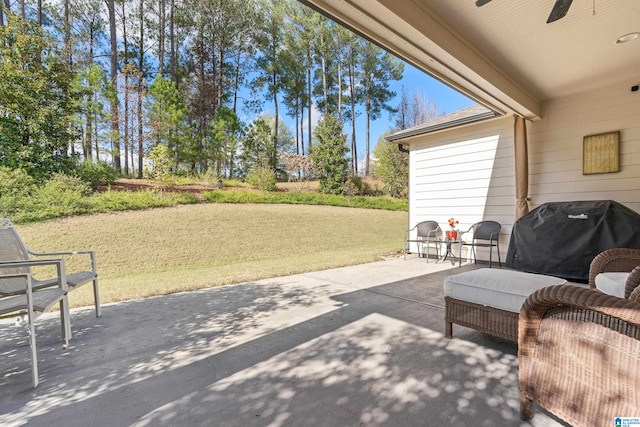 view of patio / terrace with ceiling fan and area for grilling