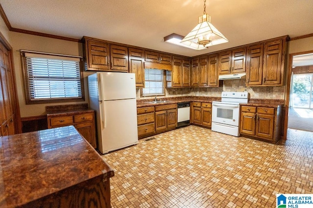 kitchen featuring backsplash, ornamental molding, white appliances, sink, and pendant lighting