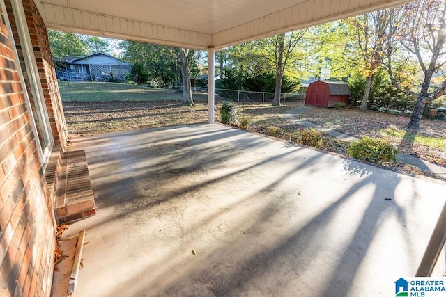 view of patio / terrace featuring a storage shed