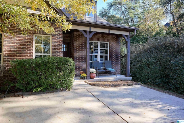 entrance to property with a patio