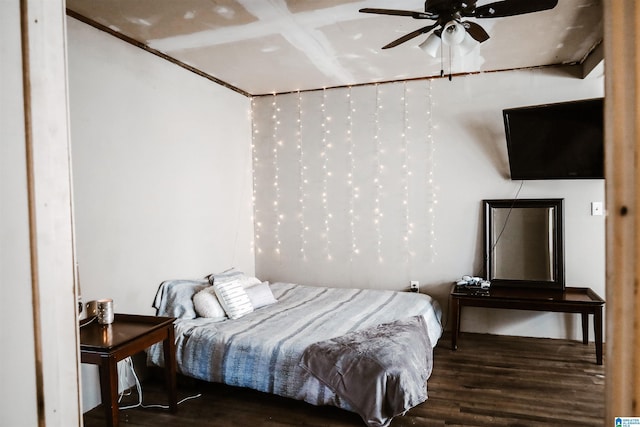 bedroom featuring ceiling fan and dark wood-type flooring