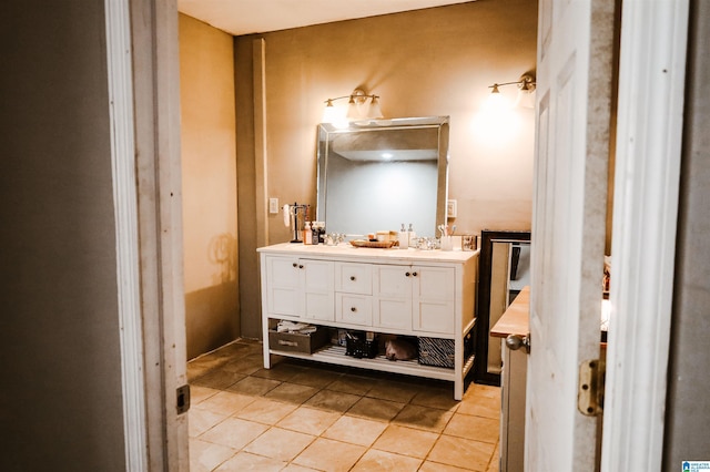 bathroom with tile patterned flooring and vanity