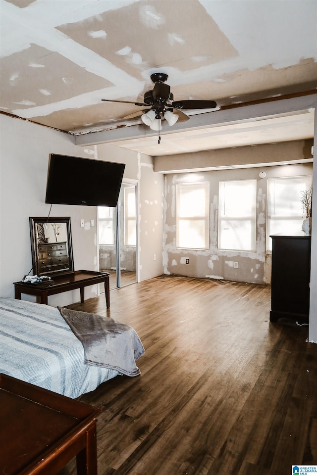 bedroom with ceiling fan and dark hardwood / wood-style floors