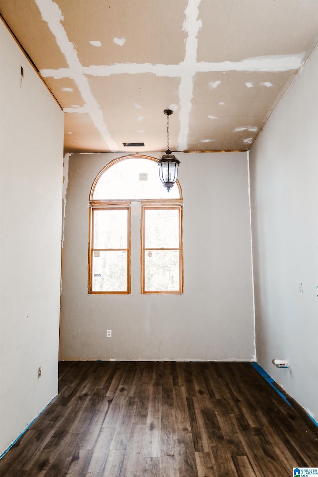 unfurnished room featuring dark hardwood / wood-style floors