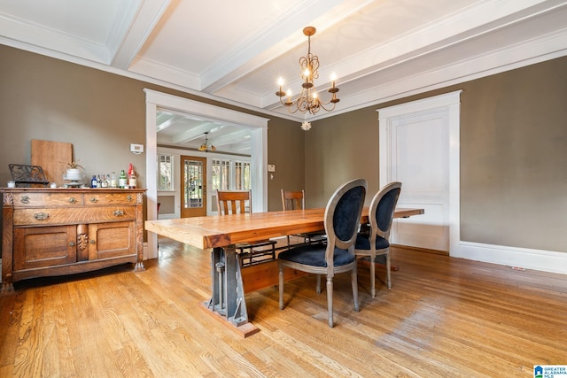 dining room featuring light hardwood / wood-style flooring, beamed ceiling, ornamental molding, and an inviting chandelier