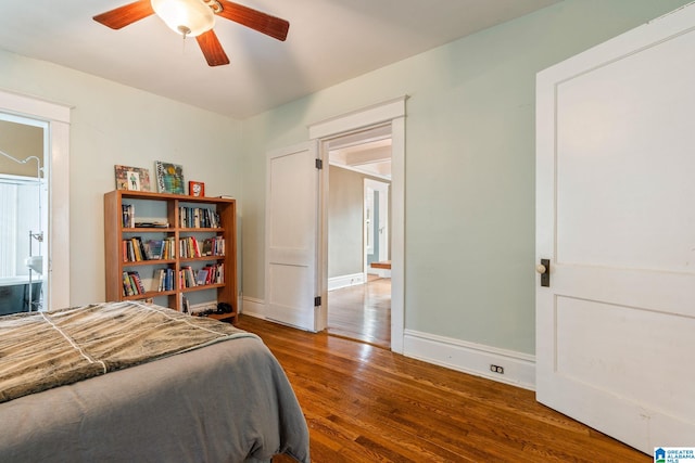 bedroom featuring dark hardwood / wood-style floors and ceiling fan