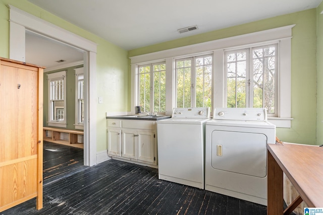 washroom featuring separate washer and dryer, french doors, cabinets, and dark hardwood / wood-style flooring