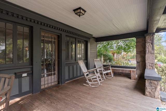 wooden terrace featuring a porch