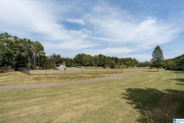 view of home's community featuring a rural view and a yard