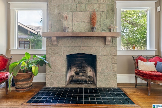 sitting room featuring hardwood / wood-style flooring and a fireplace