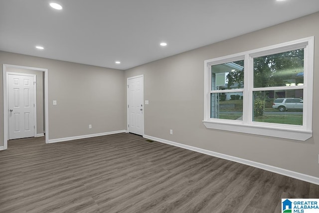 empty room featuring dark hardwood / wood-style floors