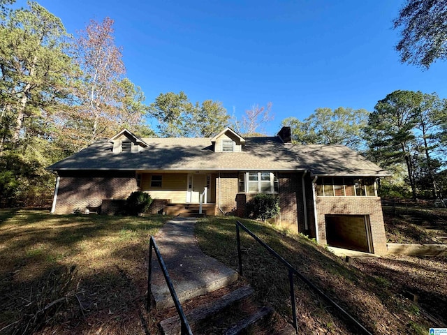 single story home with a front yard and a garage