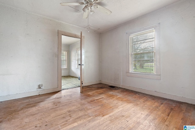 unfurnished room with ceiling fan and light hardwood / wood-style flooring