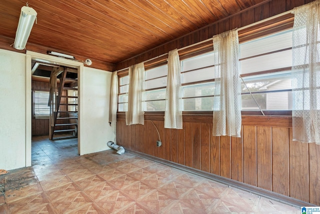 spare room featuring plenty of natural light and light parquet floors