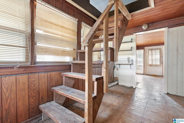 stairway with wooden walls