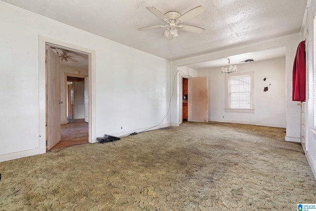 unfurnished room featuring ceiling fan with notable chandelier, carpet floors, and a textured ceiling