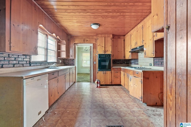 kitchen featuring wooden walls, white dishwasher, oven, and wooden ceiling