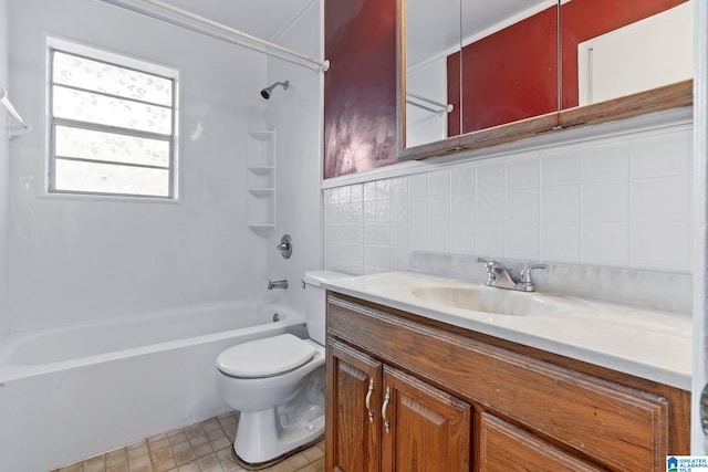 full bathroom with shower / washtub combination, vanity, tile walls, and toilet