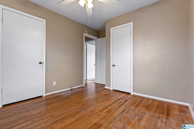 unfurnished bedroom featuring ceiling fan and light wood-type flooring