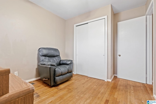 living area with wood-type flooring