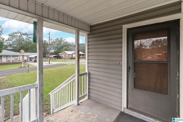 property entrance with covered porch