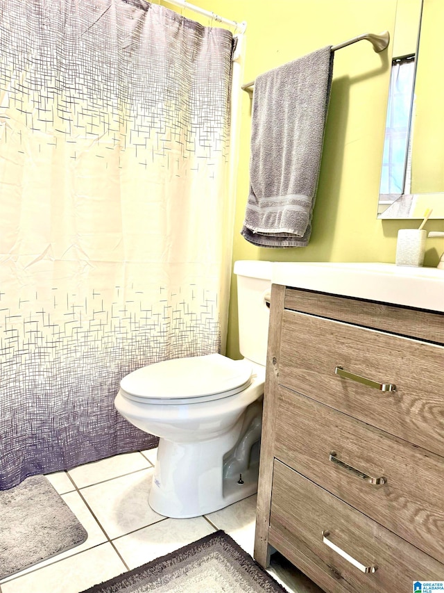 bathroom with tile patterned floors, vanity, and toilet