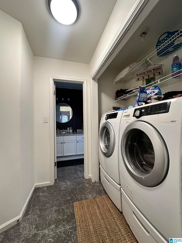 washroom with washing machine and dryer