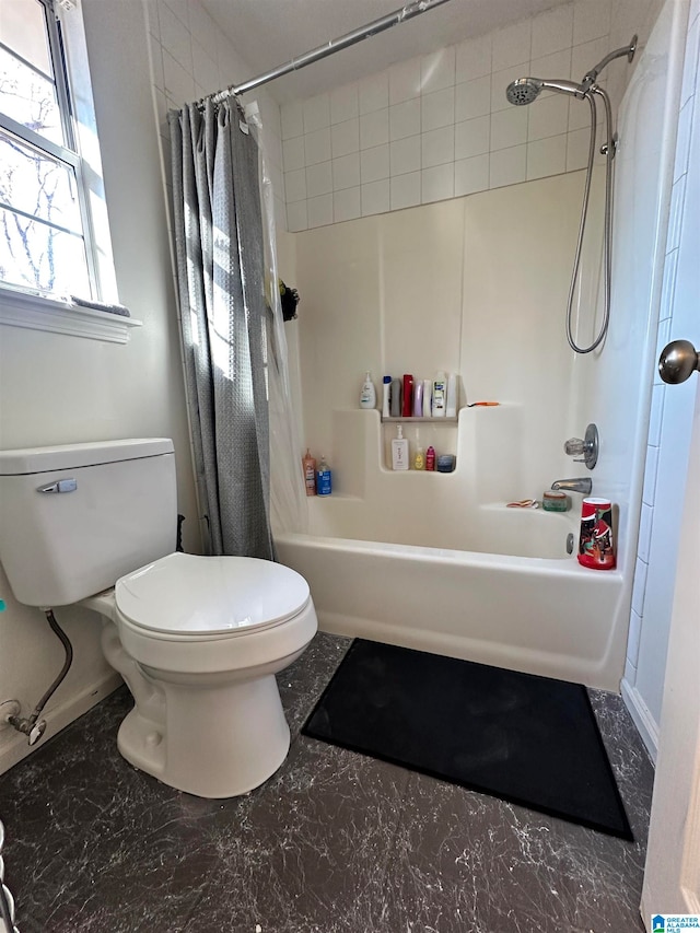 bathroom featuring shower / bathtub combination with curtain and toilet