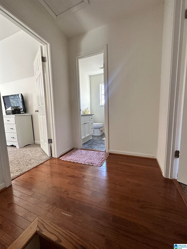 corridor featuring dark wood-type flooring