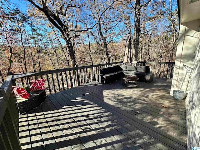 wooden deck with an outdoor living space