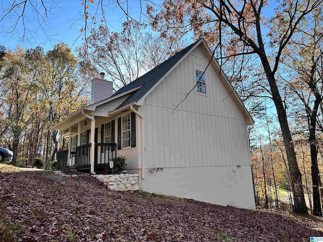 view of side of property featuring a porch