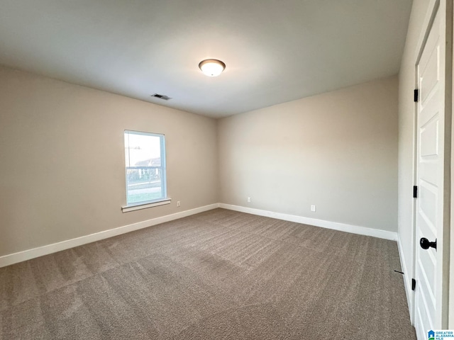 spare room featuring carpet flooring