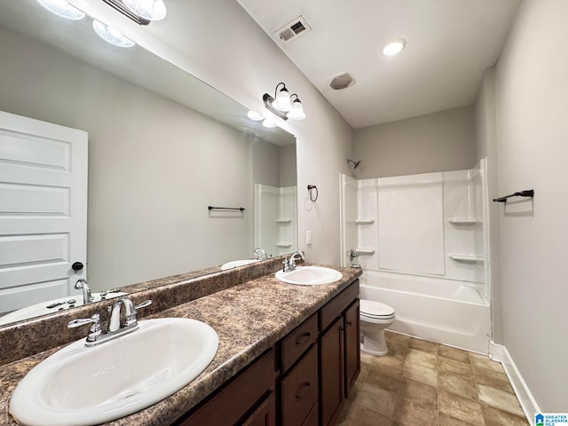 full bathroom featuring vanity, bathtub / shower combination, and toilet