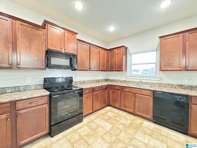 kitchen with black appliances and sink