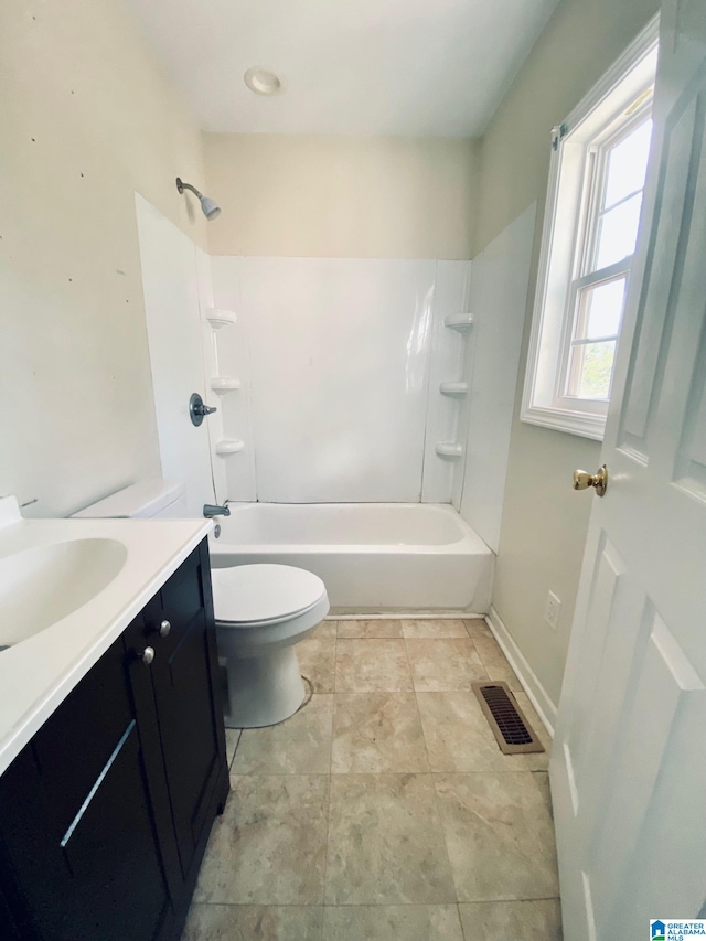 full bathroom featuring bathing tub / shower combination, vanity, and toilet