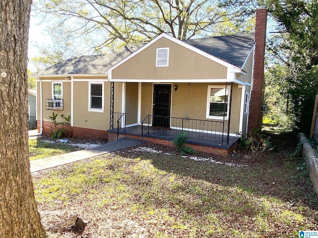 ranch-style house featuring cooling unit and covered porch