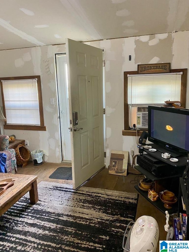 miscellaneous room featuring dark wood-type flooring