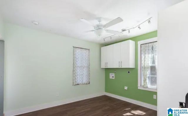 718 Blue Ridge Dr, Anniston, AL 36207 - empty room with a ceiling fan, rail lighting, dark wood-type flooring, and baseboards