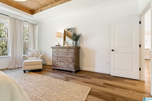 living area featuring ornamental molding, hardwood / wood-style flooring, a tray ceiling, and wooden ceiling