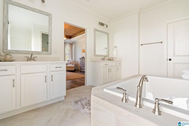 bathroom with hardwood / wood-style floors, vanity, and crown molding