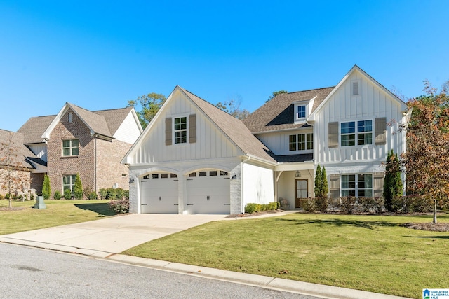 view of front of house featuring a front lawn and a garage