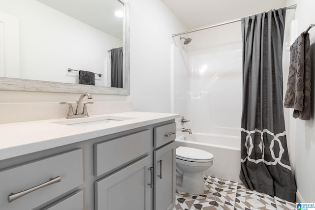 full bathroom with tile patterned floors, vanity, toilet, and shower / bath combination with curtain