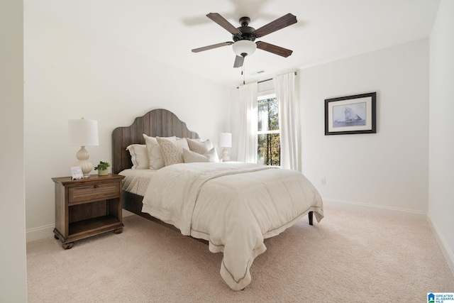 bedroom with light carpet and ceiling fan