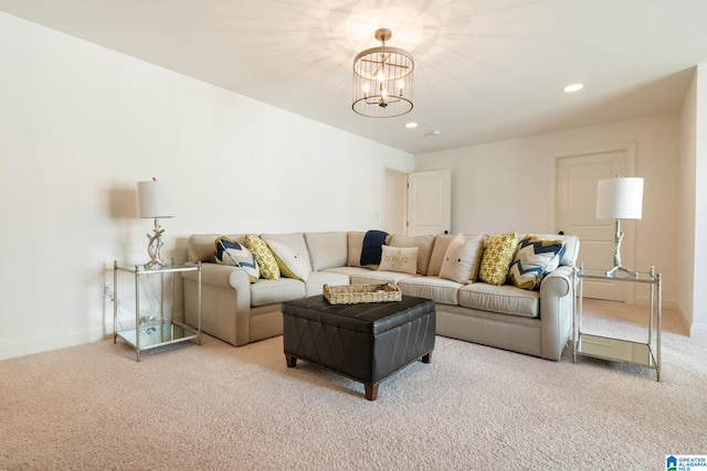 living room with carpet flooring and a notable chandelier