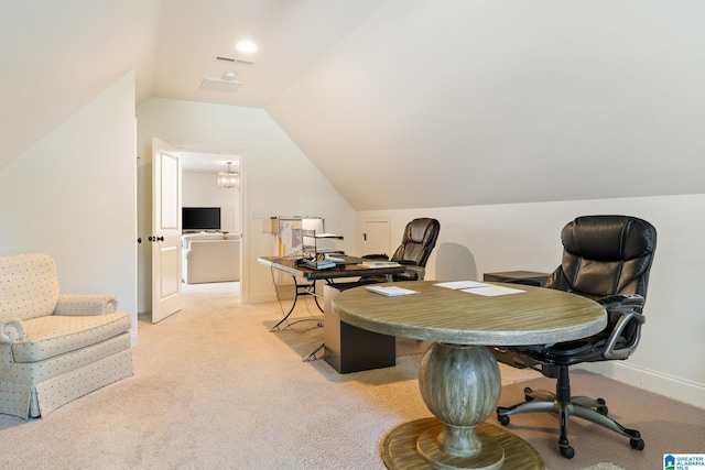 carpeted office featuring lofted ceiling