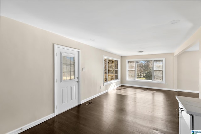 interior space with dark hardwood / wood-style flooring